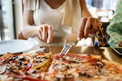 Midsection of man preparing food