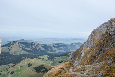 Scenic view of landscape and mountains against sky