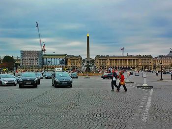 View of buildings against cloudy sky