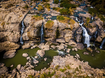 High angle view of rock formation by river