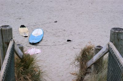 Deck chairs on sand at beach
