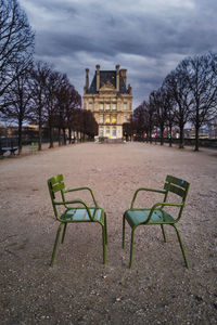 Empty chairs and tables in park