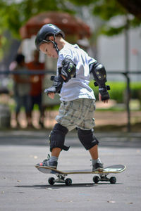 Full length of boy skateboarding on skateboard