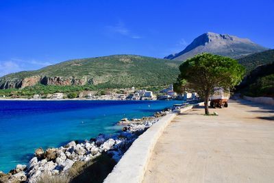 Panoramic view of sea against blue sky