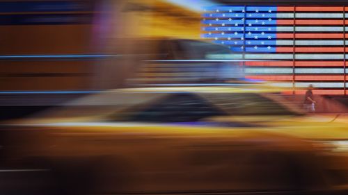 Blurred motion of car on street at night