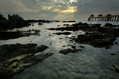 Scenic view of sea against sky at sunset