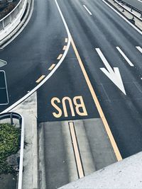 High angle view of road sign on city street