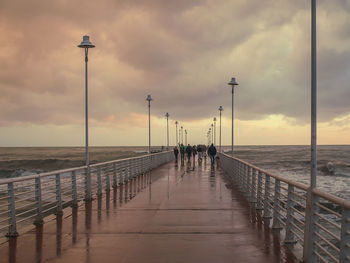 People on beach against sky