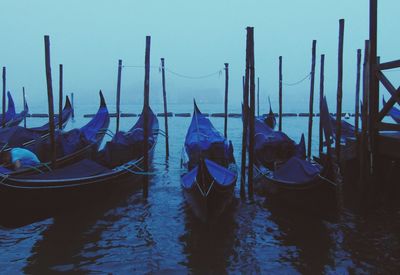 Boats moored in canal