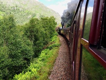 Train on railroad track against sky