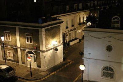 Buildings in city at night