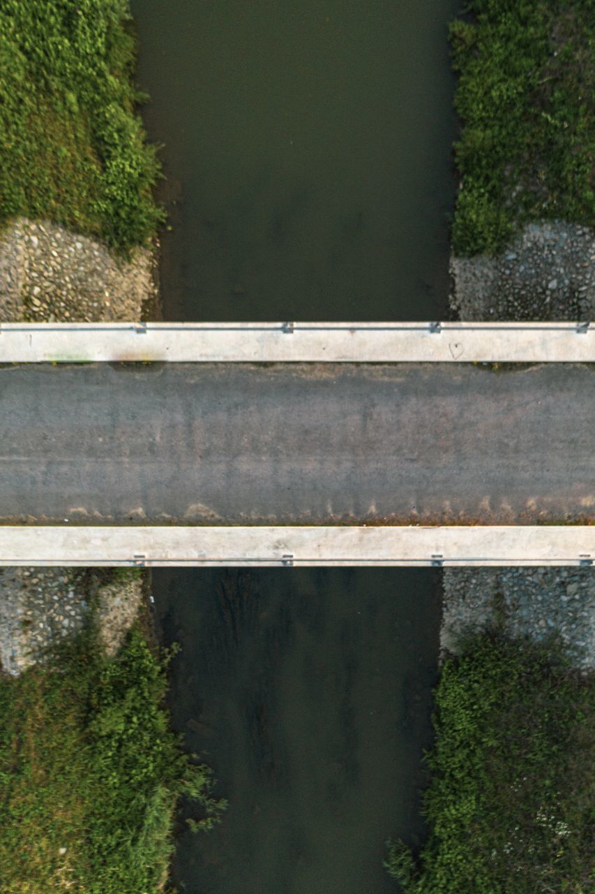 HIGH ANGLE VIEW OF BRIDGE OVER ROAD