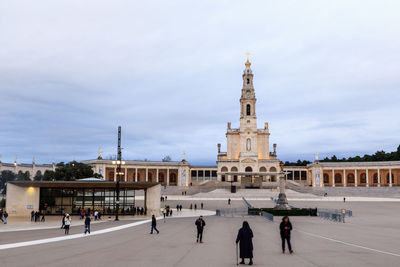 Group of people in front of basilica of our lady of the rosary 