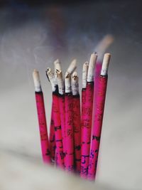 Close-up of burning incenses