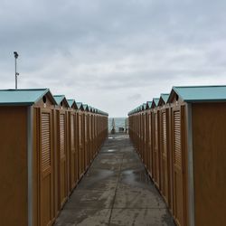 View of beach huts against sky