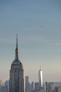 Modern buildings in city against sky