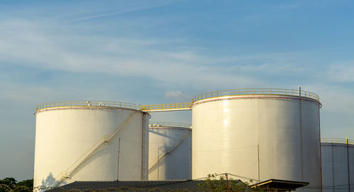 Low angle view of factory against sky