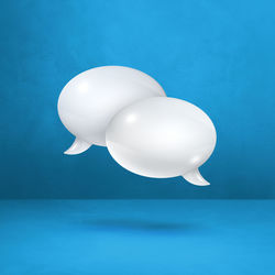 Close-up of balloons against blue background
