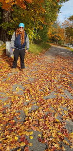 Full length of man standing by tree during autumn