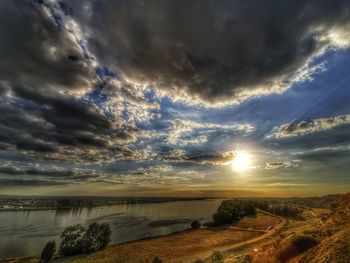 Scenic view of dramatic sky over land