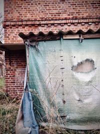 Low angle view of weathered wall of old building