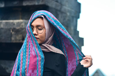 Portrait of a woman with traditional weaving. cetho temple, indonesia