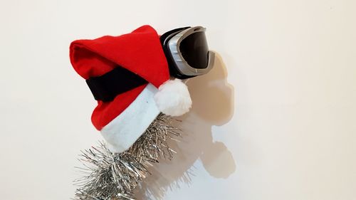 Close-up of christmas decorations over white background