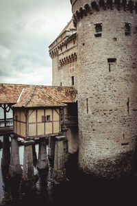 Old building against cloudy sky