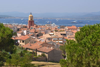 High angle view of temple by sea against sky