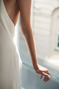 Midsection of woman holding hands