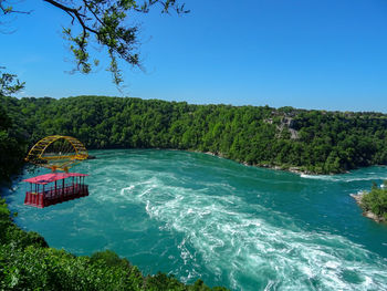 Scenic view of sea against clear blue sky