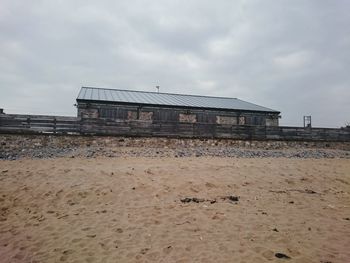 Built structure against cloudy sky