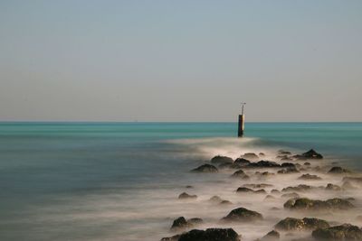 Scenic view of sea against clear sky