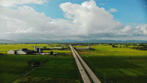 Scenic view of agricultural field against sky