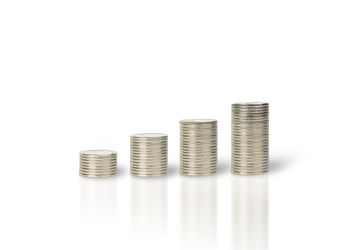 Close-up of coins on white background