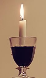 Close-up of wineglass against black background