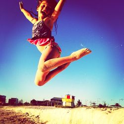 Woman jumping in mid-air