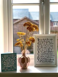 Flower vase on table at home