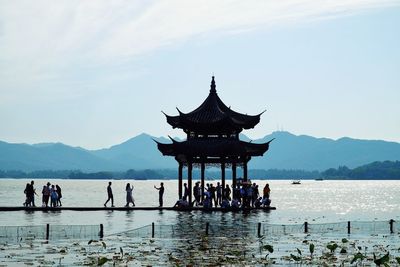 People at observation point against sky