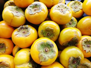 High angle view of persimmons for sale at market stall