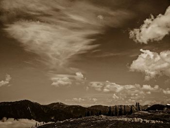 Scenic view of landscape against cloudy sky