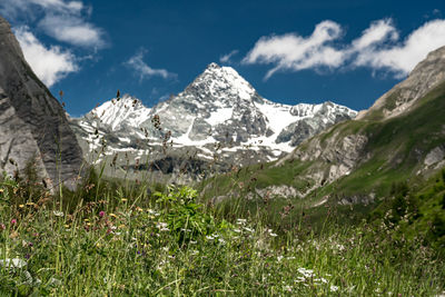 Scenic view of snowcapped mountains against sky