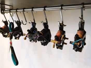 High angle view of machines hanging against wall