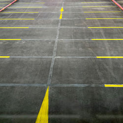 High angle view of yellow umbrella on road