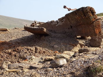 Rock formation on land against sky