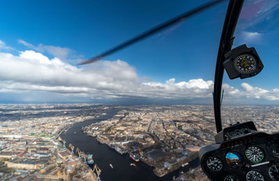 Aerial view of cityscape against sky