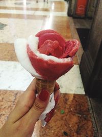 Cropped image of woman holding ice cream