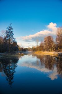 Scenic view of lake against blue sky