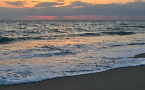 Scenic view of sea against dramatic sky