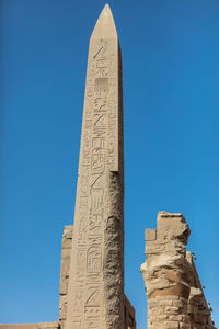 Different columns with hieroglyphs in karnak temple.